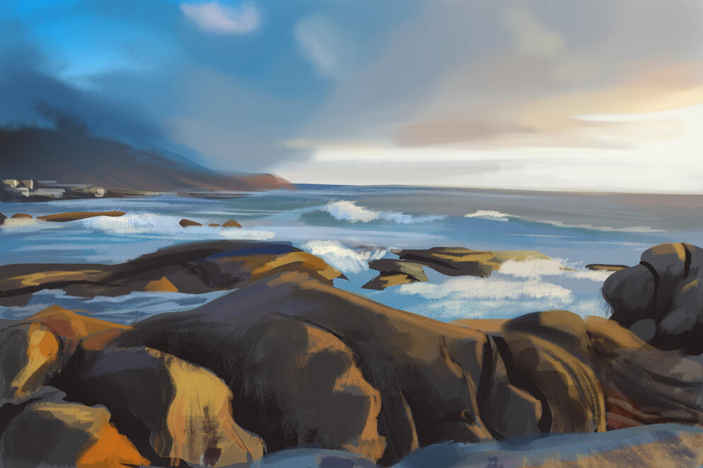 A sunrise overlooks an ocean, which hits into rocks that are in the water. A hill is in the distance partially covered by clouds.